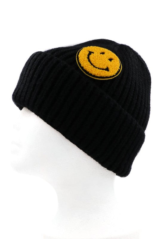 Knit smiley face beanie in Black